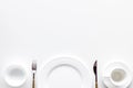 White plates and cup for table setting on white background top view mockup Royalty Free Stock Photo