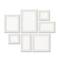 Empty white pocture frames, 3d photo borders on wall Royalty Free Stock Photo