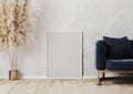 Empty white poster frame mockup on the wooden parquet near gray concrete wall in modern interior design scene with blue sofa, vase Royalty Free Stock Photo