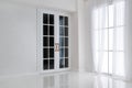 Empty white room with big window and glass french door Royalty Free Stock Photo
