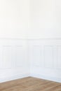 Empty white room corner with parquet floor and trimmed wall Royalty Free Stock Photo