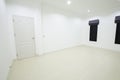 Empty white room with door and window Royalty Free Stock Photo