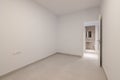 Empty white room with an open door - access to the bathroom. The concept of selling housing in a new building or an Royalty Free Stock Photo