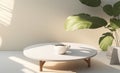 An empty white round coffee table next to a blank beige wall with morning sunlight