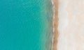 Empty white sand beach and calm turquise sea. Aerial view directly above