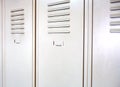 Empty white school metal lockers Royalty Free Stock Photo