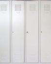 Empty white school metal lockers Royalty Free Stock Photo