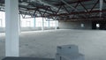 Empty white space for company in new building. Stock footage. Open, empty warehouse with bare walls and steel beams