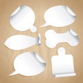 Empty white stickers on a paper - speech bubbles, board for pizza, cutting board, bone for pet, fish. Royalty Free Stock Photo