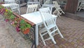 Empty white table and chairs in a summer cafe. Summer restaurant Royalty Free Stock Photo