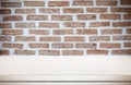 Empty white table over brick wall background, product display Royalty Free Stock Photo
