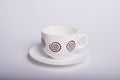 Empty white tea cup and saucer over white Royalty Free Stock Photo