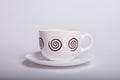 Empty white tea cup and saucer over white Royalty Free Stock Photo