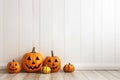 An empty white wall for Halloween mockup. Jack o lantern pumpkins decor Royalty Free Stock Photo