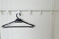 An empty white wardrobe with black cloth hanger Royalty Free Stock Photo