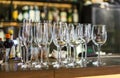 Empty white wine glasses on the table in the restaurant or bar. Table setting, close up. Glasses for alcohol Royalty Free Stock Photo