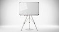 Empty whiteboard on a tripod easel for presentations and meetings Royalty Free Stock Photo