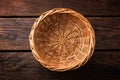 Empty wicker basket on a wooden background Royalty Free Stock Photo