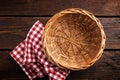 Empty wicker basket on a wooden background Royalty Free Stock Photo
