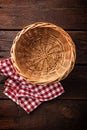 Empty wicker basket on a wooden background Royalty Free Stock Photo