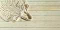 Empty wicker mesh bag on background of wooden tabletop made of sanded planks. White empty string bag