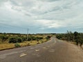 An empty wide curvy road in rural remote area
