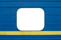 Empty window with copyspace on a blue passenger car of a train with a yellow stripe below Royalty Free Stock Photo