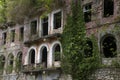 The windows of an old abandoned Soviet-built building. Tkuarchal, Abkhazia Royalty Free Stock Photo