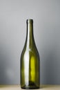 Empty wine bottle, gray background