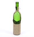 Empty wine bottle in sackcloth material Royalty Free Stock Photo