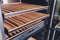 Empty Wine fridge in a kitchen home rack. Royalty Free Stock Photo
