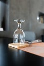 An empty wine glass is placed upside down on the dining table Royalty Free Stock Photo