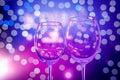 Empty wine glasses on abstract purple background. Royalty Free Stock Photo