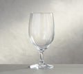 Empty wine glasses on the glass table and white background