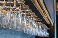 Empty wine glasses hanging on rack in bar Royalty Free Stock Photo