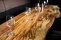 Empty wine glasses on slab table in restaurant Royalty Free Stock Photo