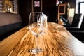 Empty wine glasses on slab table in restaurant Royalty Free Stock Photo