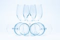 Empty wine glasses stand and lie symmetrically