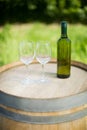 Empty wineglasses and bottle on barrel Royalty Free Stock Photo