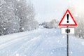 Empty winter road with sign