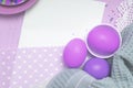 Empty wite list Easter background with fantastic violet colored eggs