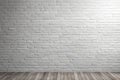 Empty white brick wall background texture with white wooden floor. Royalty Free Stock Photo