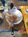 Empty wok clean metall silver big wood spoon cooking gas kitchen soy sauce oil lunch dinner chiang mai thailand class