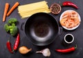 Empty wok with ingredients for cooking stir fried noodles with s Royalty Free Stock Photo