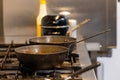 Empty Woks on a Professional Kitchen Gas Range Royalty Free Stock Photo