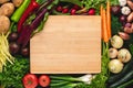 Empty Wood Cutting Board Mockup with Fresh Vegetables. Vegetarian Raw Food. Royalty Free Stock Photo