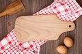 Empty wood cutting board on the table with food. Kitchen template, mockup, flat lay Royalty Free Stock Photo