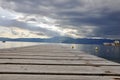 Empty wood deck pier with sea ocean view. Idyllic arbor on water, Kostrena Croatia Royalty Free Stock Photo