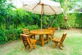 empty wood outdoor patio table and chair in home garden Royalty Free Stock Photo