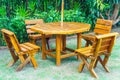 empty wood outdoor patio table and chair in home garden Royalty Free Stock Photo